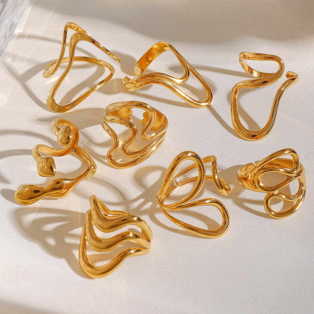 Titanium steel irregularly hollowed-out open ring