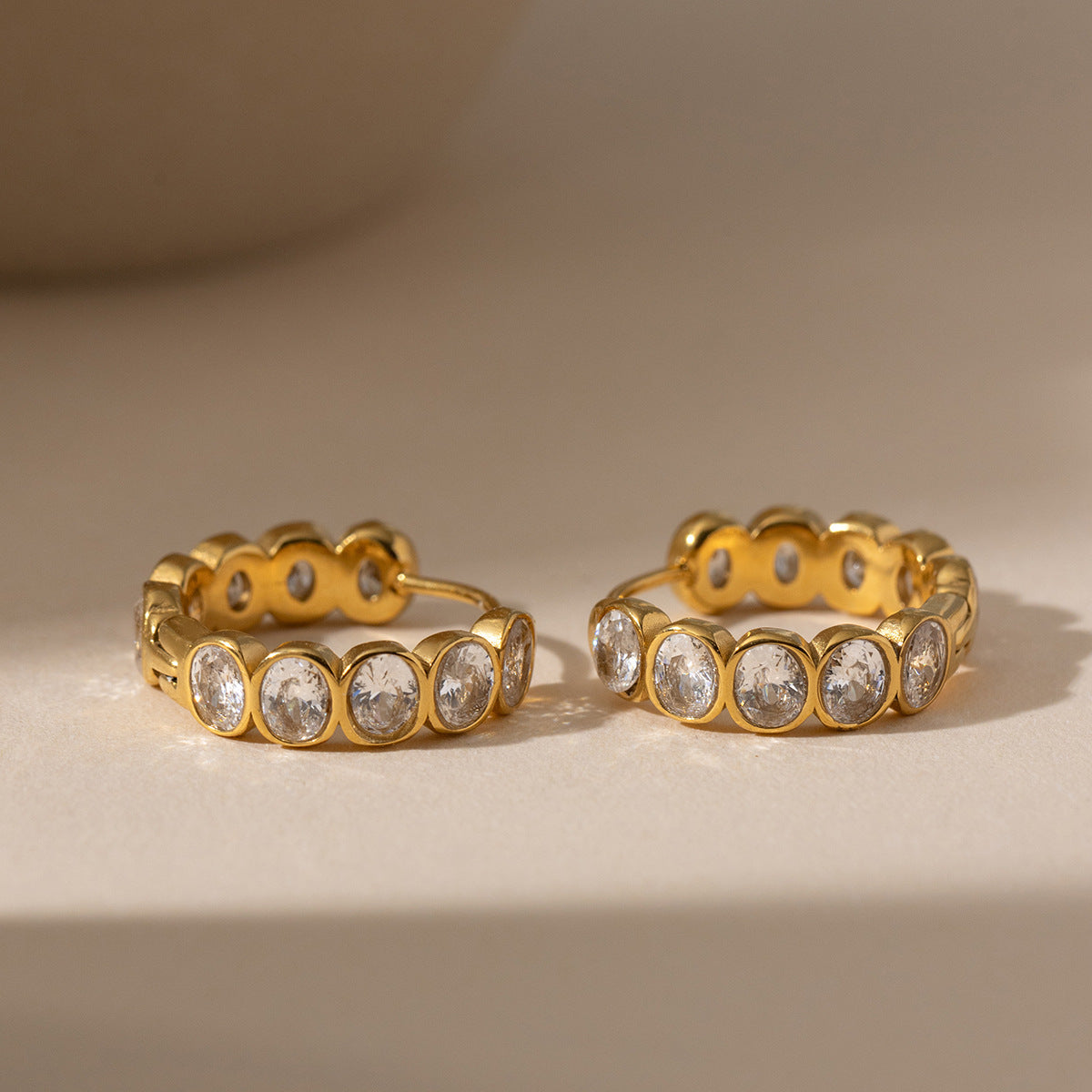 18K titanium steel egg-shaped zirconia earrings